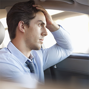 Man driving appears to be stressed out